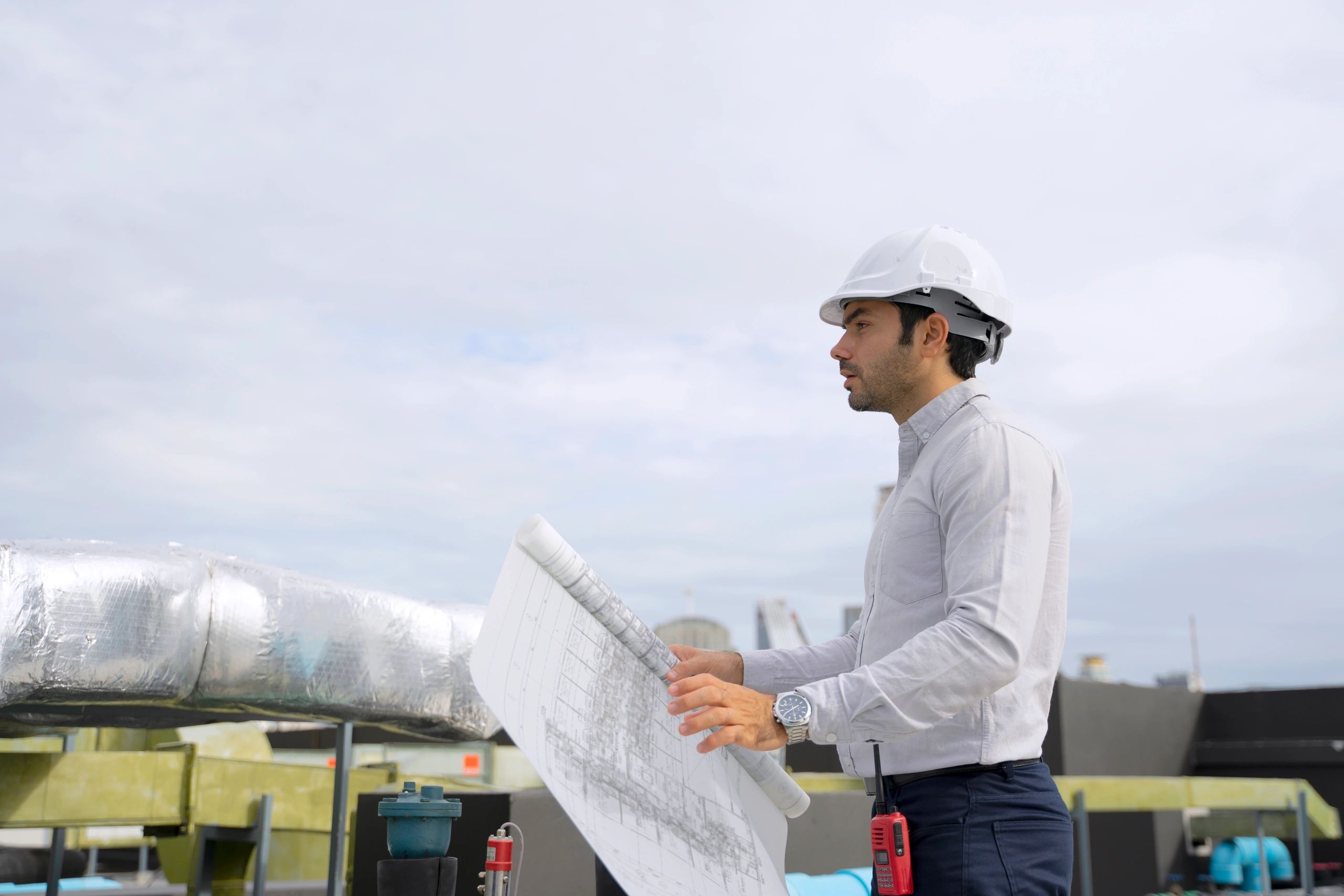 Technician inspecting an outdoor air conditioning unit