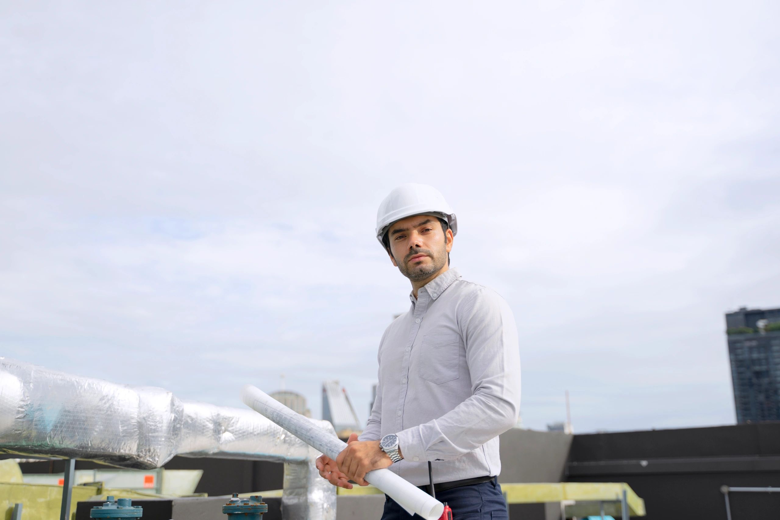 HVAC technician carrying out maintenance on rooftop equipment