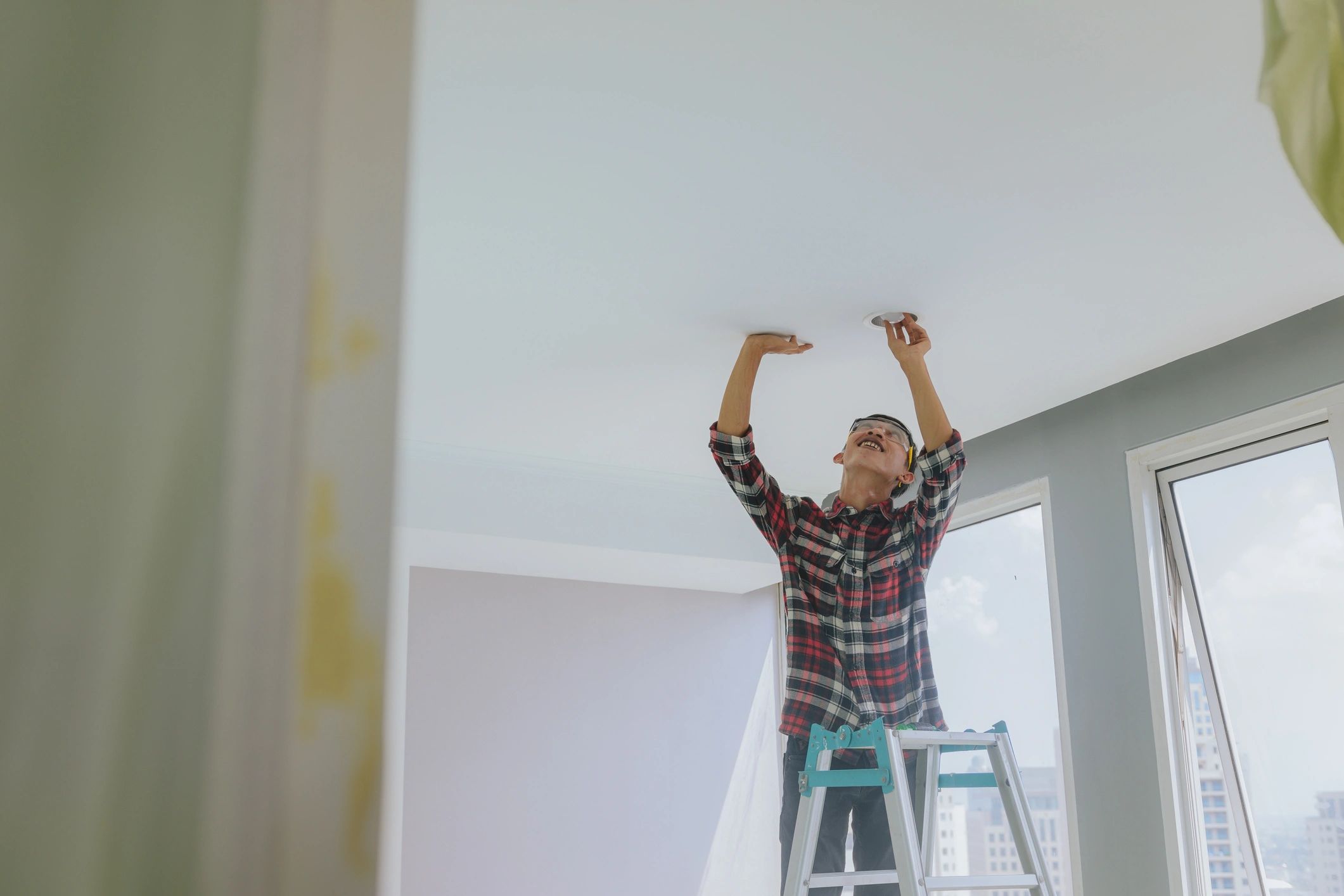 Technician repairing household appliance in a customer home